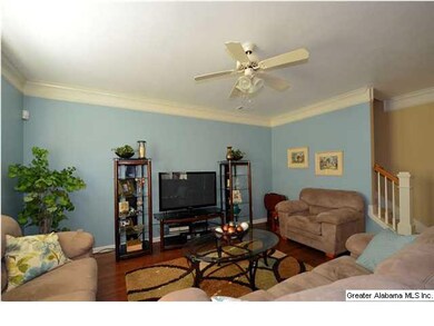 Spacious Great Room with gleaming hardwoods and ce