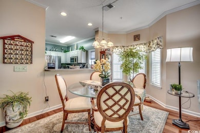 Dining area with a textured ceiling, a notable cha