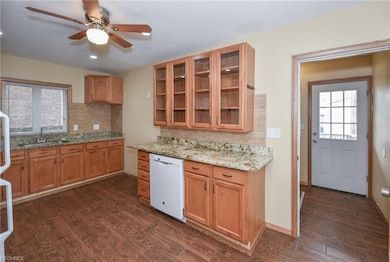 Roomy kitchen with granite and loads cabinet space.