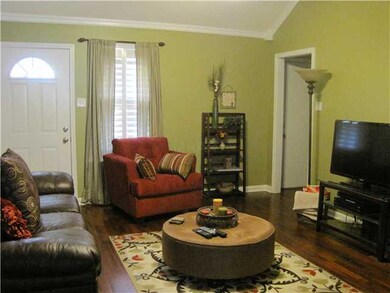Greatroom with fireplace, plantation shutters, woo