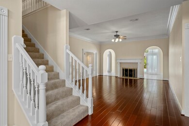 Front entry leading into Family Room; staircase leading to second floor on left.