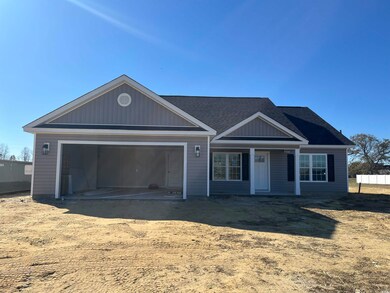 View of front of property featuring a garage