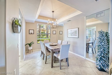 Dining room with baseboards, visible vents, light