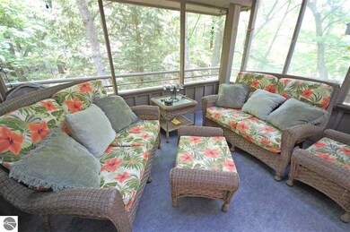 The wonderful and welcoming screened in porch.