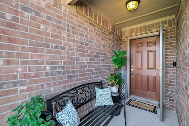 There is a welcoming covered front door area.