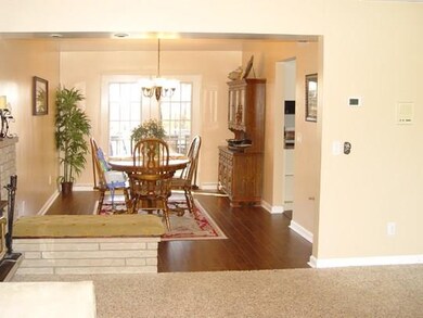 Dining room open to living room, with french doors