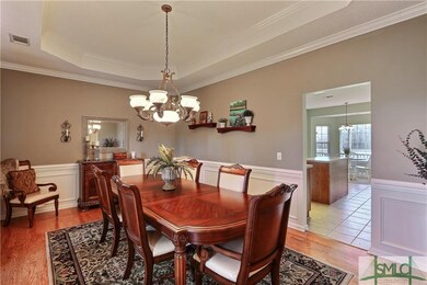 Dining Room Features Hard Wood Flooring, Trey Ceil