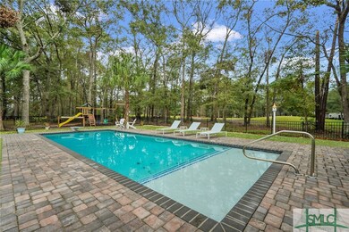 Tropical saltwater pool w paver pool deck and shal