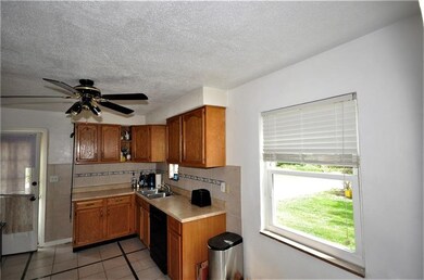 The large space by the window would be a great space for your table and chairs.