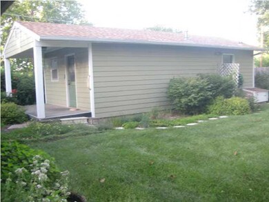 Detached office has a half bath and ample space fo