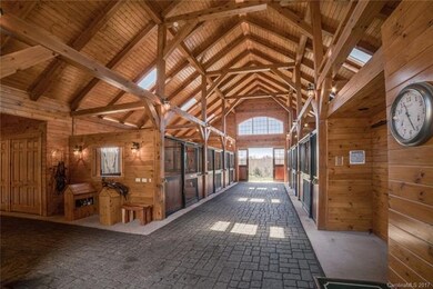 Equestrian wing includes 14' wide aisles, six larg