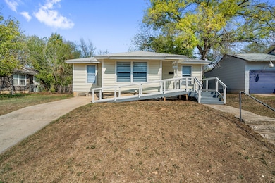 Bungalow-style home featuring a front yard and concrete driveway