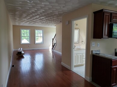 Living Room with half bathroom off to the right