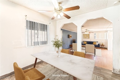 Dining room with a ceiling fan, plenty of natural