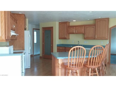 Large kitchen with island and pantry closet with b
