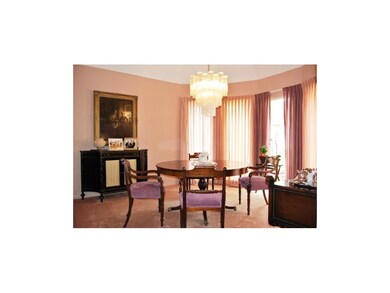 Fabulous Round Dining Room with Bay Windows & Crys
