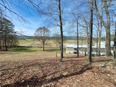 View of yard featuring a view of rural / pastoral area and fence