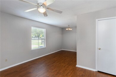 Unfurnished room with baseboards, ceiling fan with