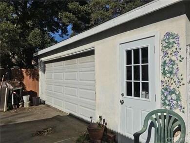 Additional garage in back.