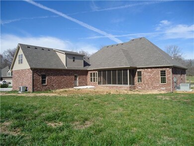 The back of this home is as pretty as the front and a great place for children or pets.