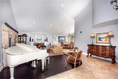 Dramatic entry with double wood doors, Vaulted cei