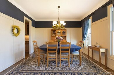 Formal dining room with wainscoting and crown mold