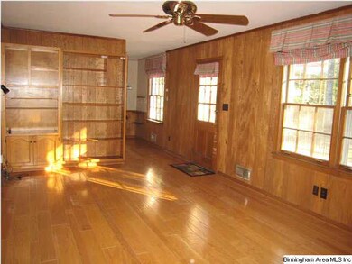 Nice bright den with built-in bookcases on one end
