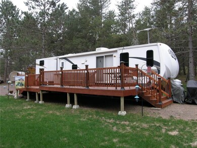 Storage Locker at landing area by front stairs and end view of the beautiful deck.
