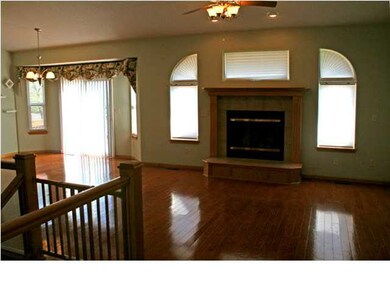 Stunning arched windows around living room firepla