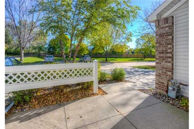 Exterior Front. Private patio overlooking green sp