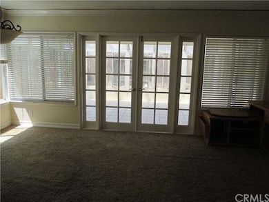 French doors from family room to the sunroom.