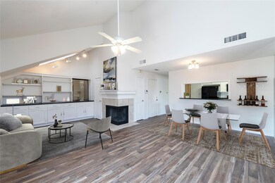 Virtually staged Dining space with ceiling fan, wo