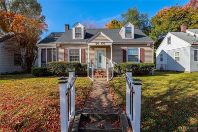 New england style home featuring a front yard