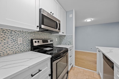 Kitchen featuring stainless steel appliances, dec