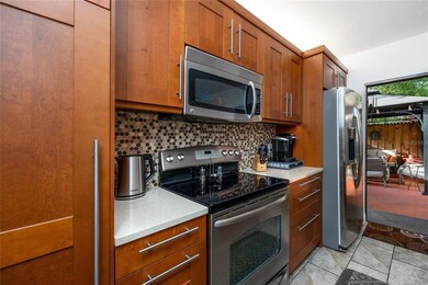 Updated kitchen cabinets, appliances and modern ti