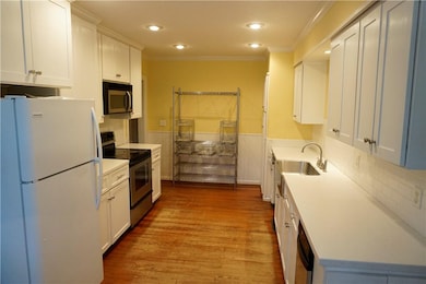 Wonderful kitchen.  Baker's rack at the end will s