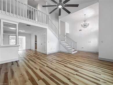 Unfurnished living room with a high ceiling, wood 