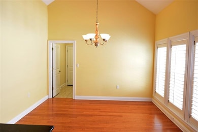 High ceiling dining area with wonderful lighting