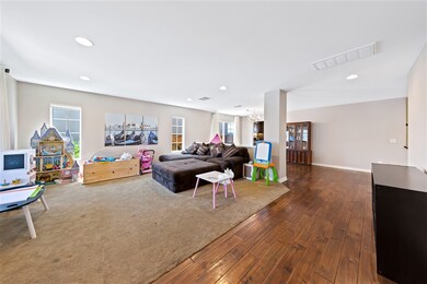 Entryway, Living Room and Formal Dining Room as seen as you enter the home.