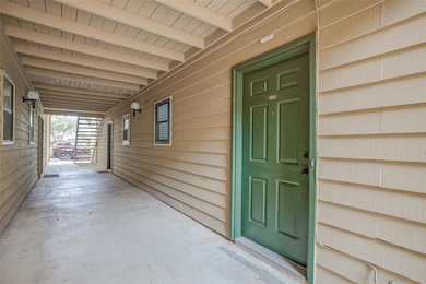 Property entrance featuring covered porch