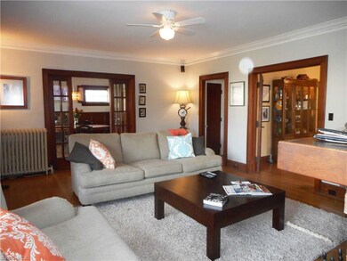 Spacious Living Room with French Doors to Library and Dining Room