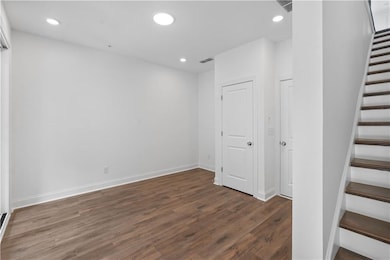 The terrace level entry leads to a flex/media room with hard surface flooring. Create the space that suits your lifestyle.