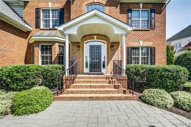 Dramatic front door entryway with stamped concrete