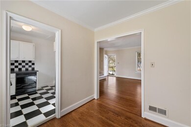 View from dining room into kitchen and living room