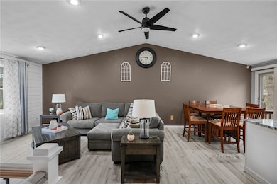 Wide open living & dining spaces w/vaulted ceiling