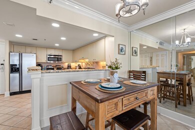 Dining room featuring a notable chandelier, crown 