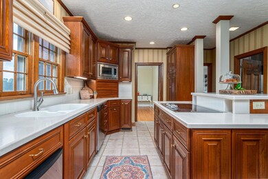 Custom Kitchen with Tons of Cabinets with Corian Counters