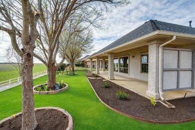 View of yard featuring a patio area and fence