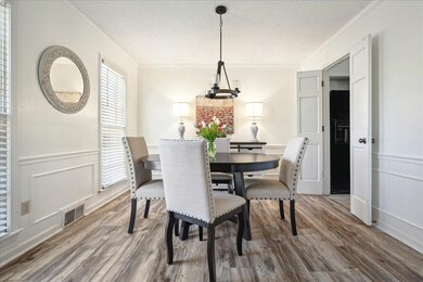 Dining room featuring visible vents, a textured ce