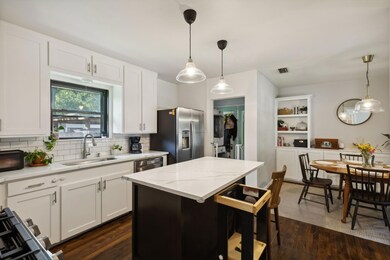 Kitchen featuring pendant lighting, sink, a kitche